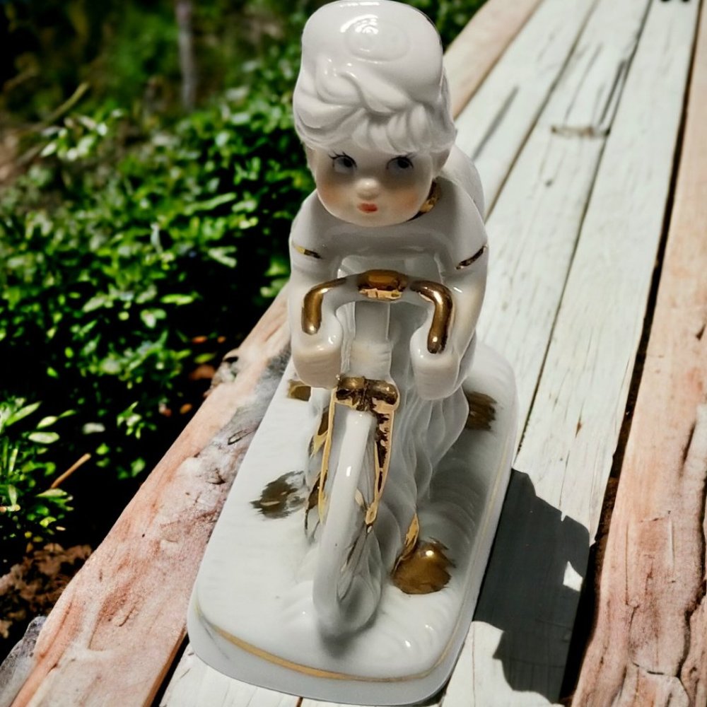 French Child Cyclist White Glazed Porcelain Figurine With Gold Trim I. Rice & Co